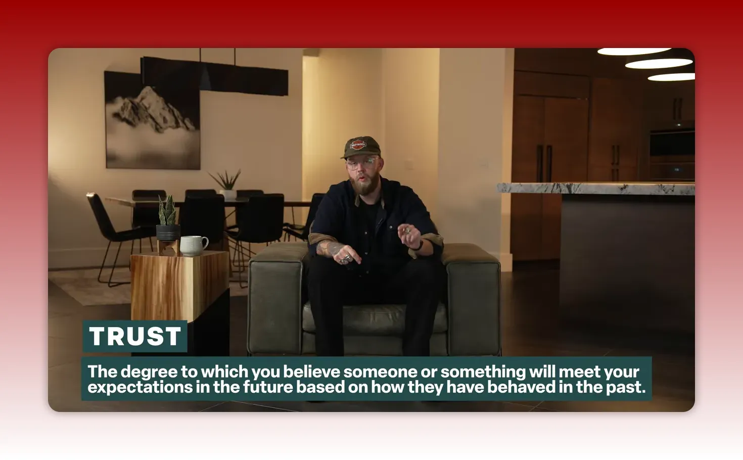 Centered shot of presenter with a prominent 'TRUST' title card and definition below