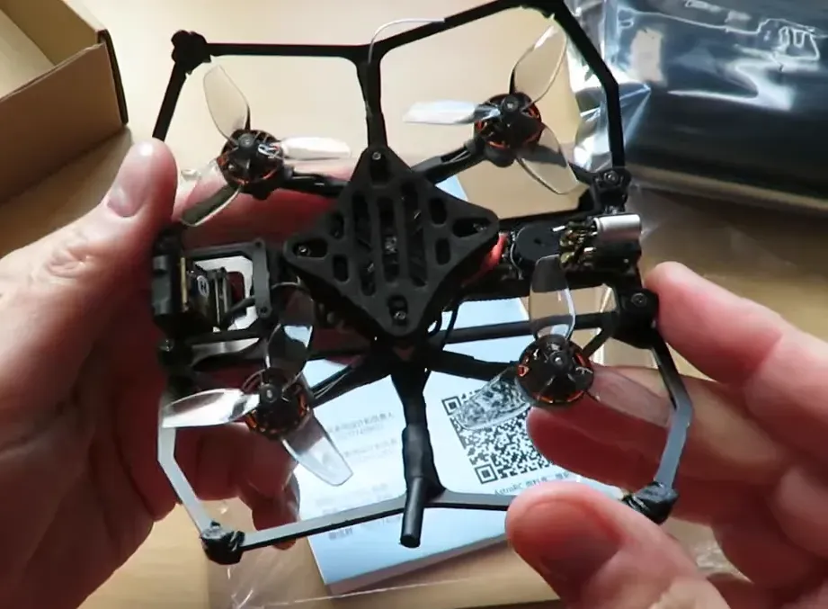 Carbonfly 80 top view showing F411 flight controller stack, 12A ESC area, motors and antenna