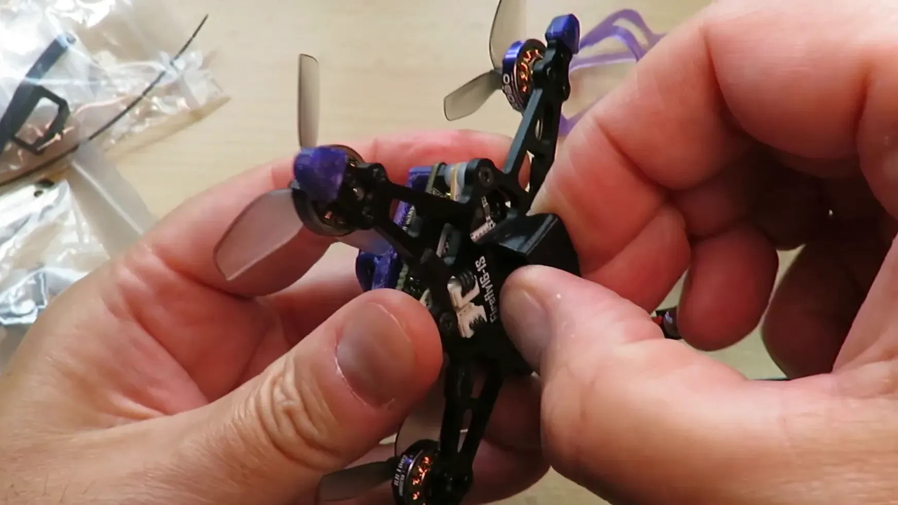 Flywoo Firefly16 battery twist-off and plug-in motor detail