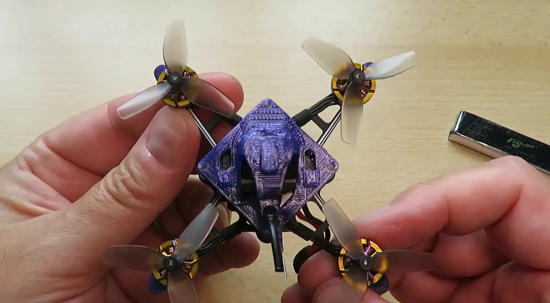 Flywoo Firefly16 Nano Baby V3 handheld in the palm