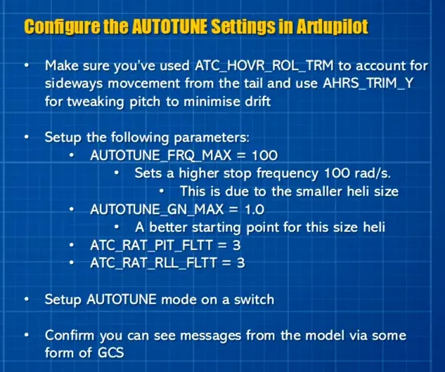 Clear view of presenter holding a small pink RC helicopter with AutoTune parameter text on the right