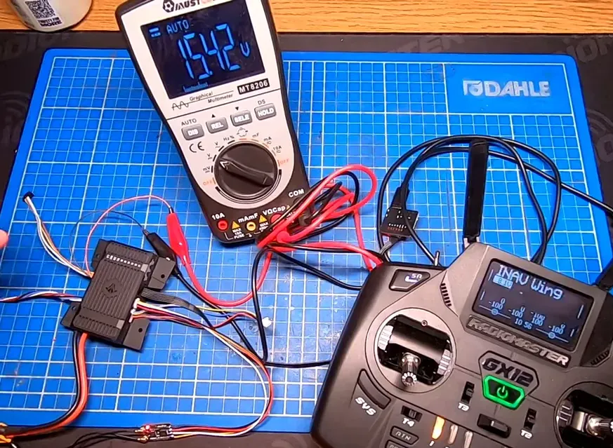 Wires from the AIO FC connected to a voltmeter to demonstrate VTX power switching