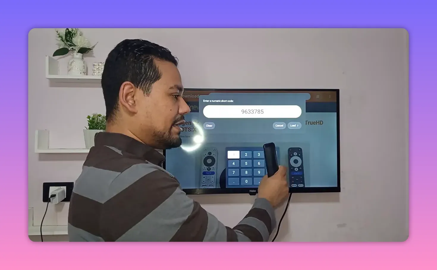 Android TV Downloader screen showing numeric short code 9633785 with remote in hand