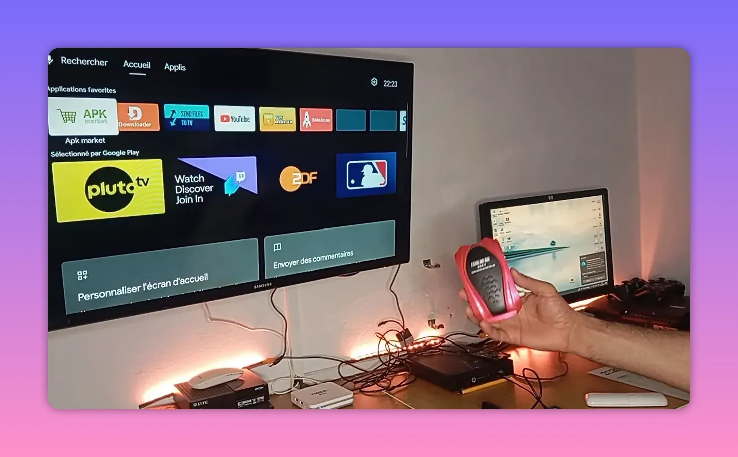 Android receiver box home screen displayed on TV while using a handheld device