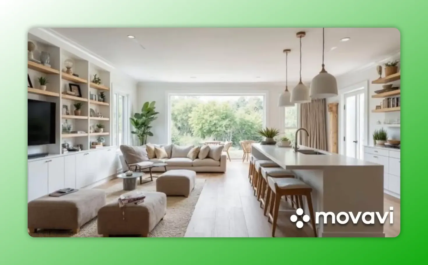 Wide open-plan kitchen and living area with a long island, stools, sofa and large picture window showing clear traffic flow.