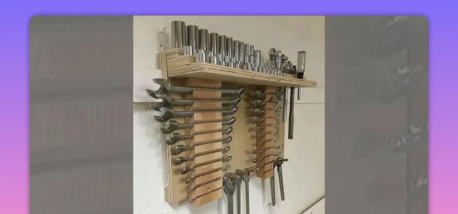 wooden wall rack with wrenches hung in slots and a shelf above holding sockets