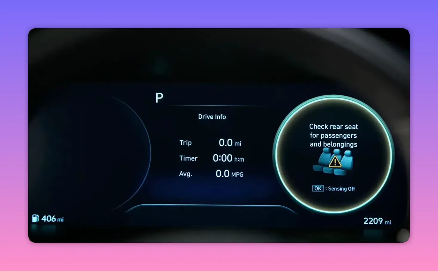 Digital instrument cluster showing 'Check rear seat for passengers and belongings' reminder