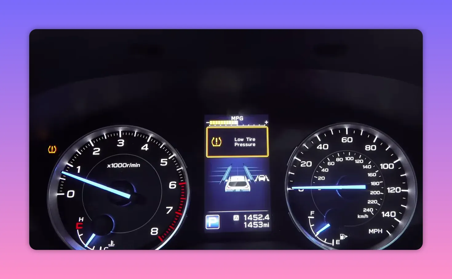 car dashboard display showing a 'Low Tire Pressure' warning with the tire pressure icon