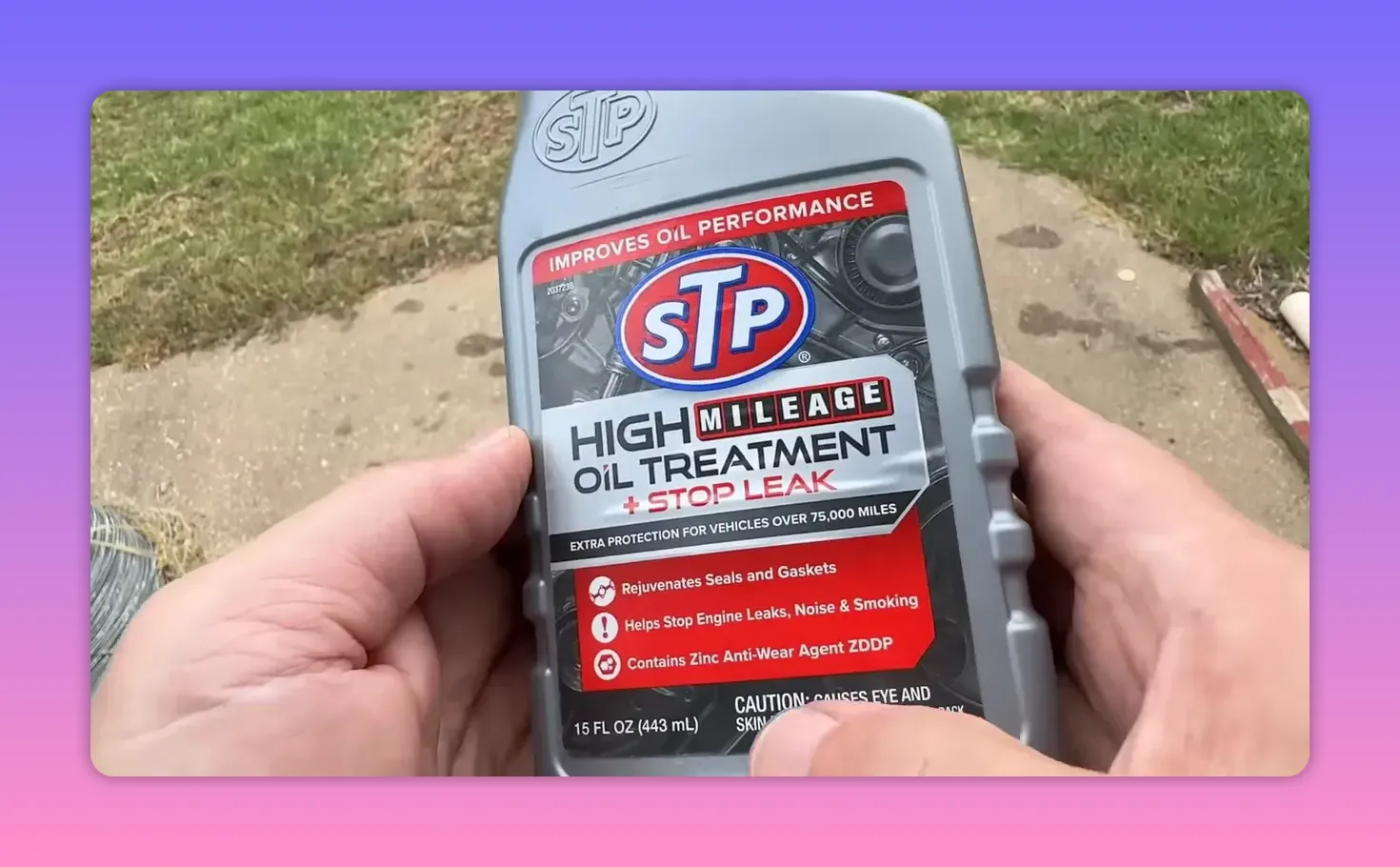 Front label of STP High Mileage Oil Treatment bottle showing 'High Mileage Oil Treatment + Stop Leak' text