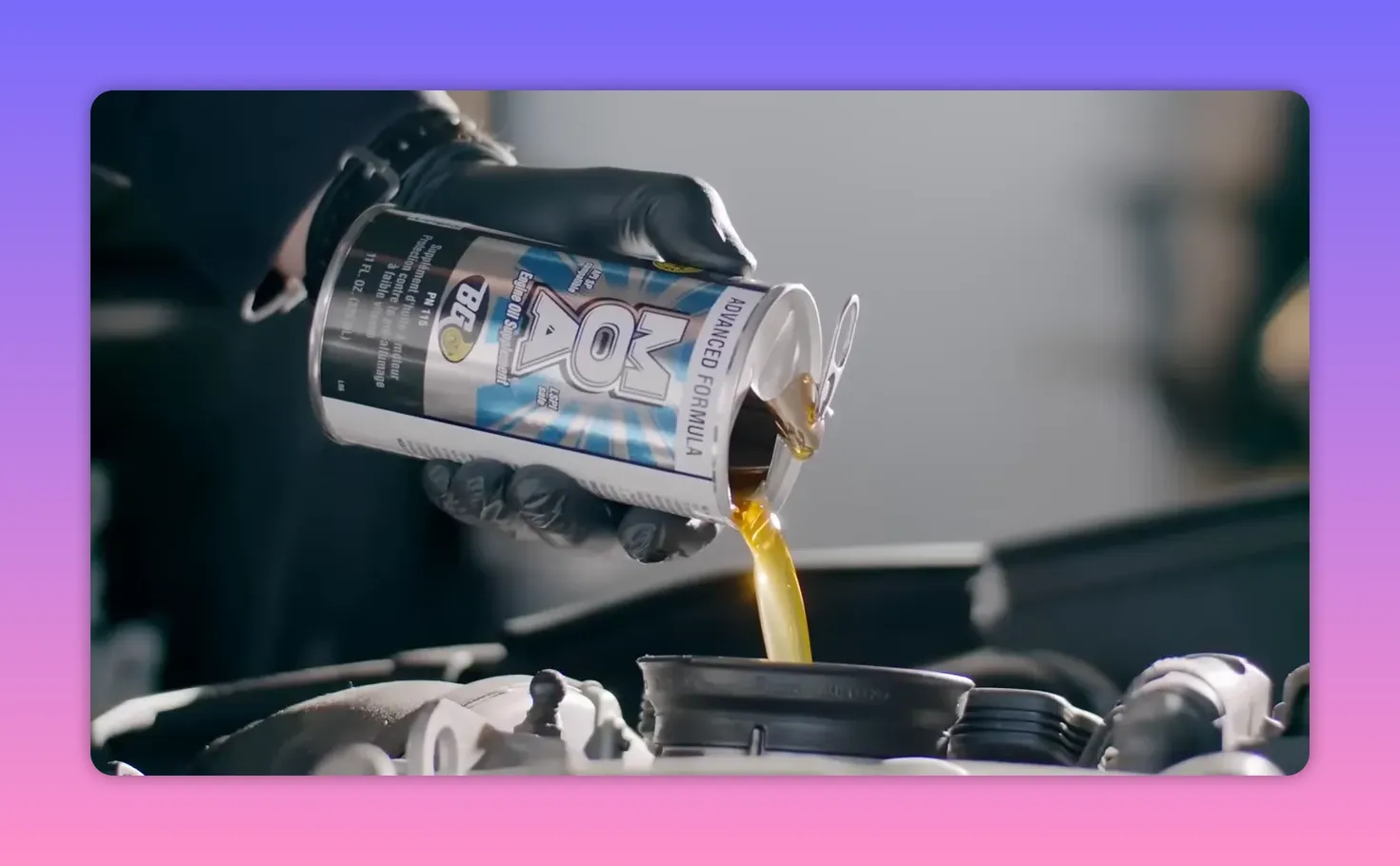 Pouring BG MOA oil supplement into the engine oil fill opening