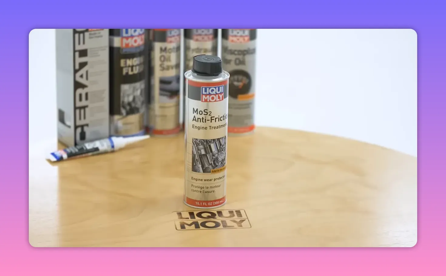 Front view of Liqui Moly MoS2 Anti-Friction engine treatment can on a table with other additives behind it