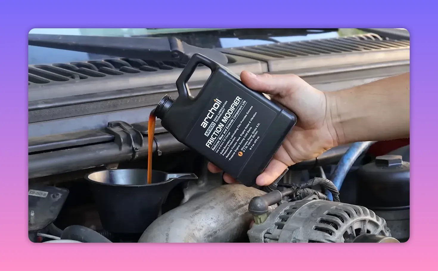 Pouring Archoil AR9100 Friction Modifier into an engine funnel, with alternator visible in the foreground.