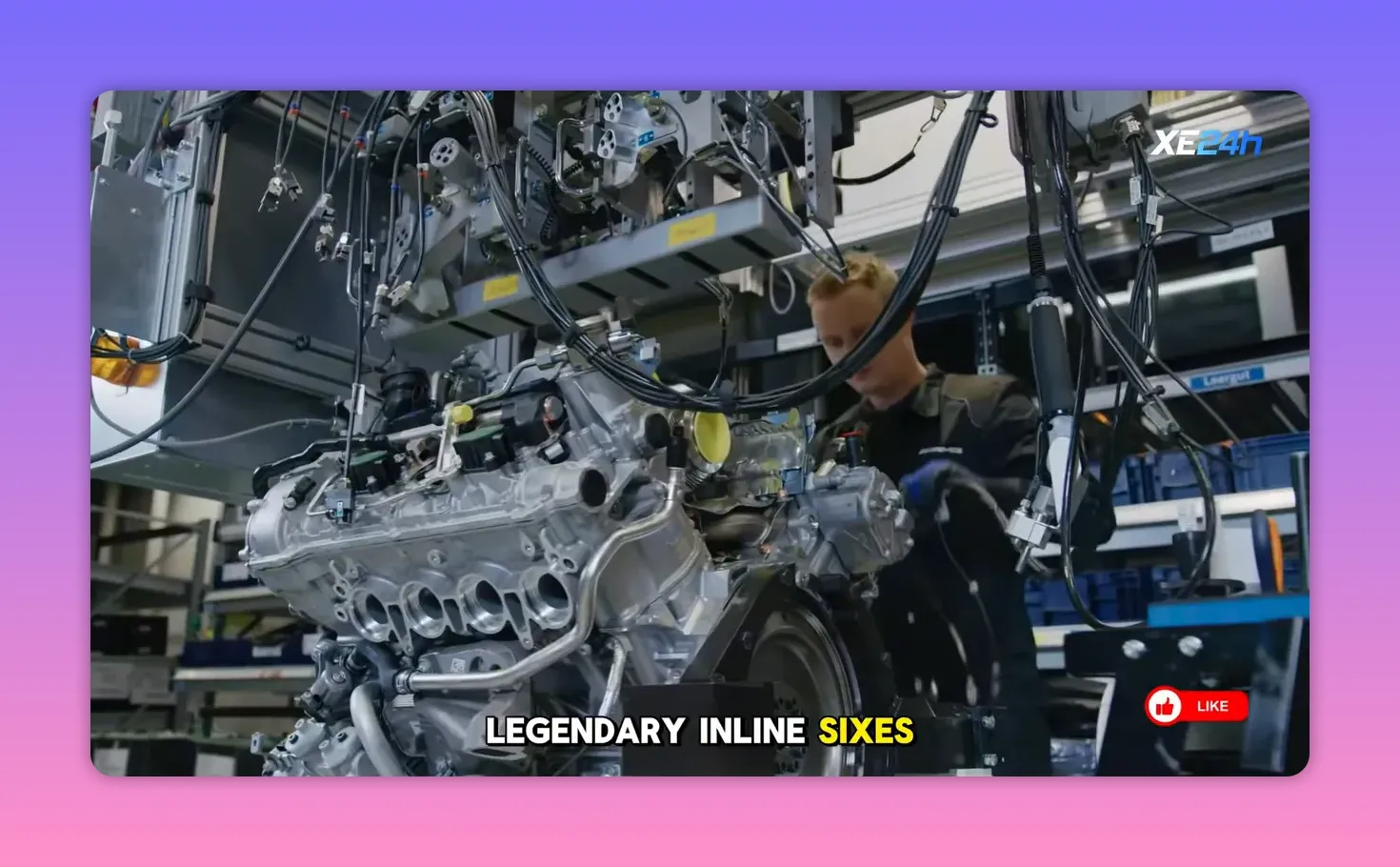Inline‑six engine on an assembly line with wiring harnesses and a technician in the background
