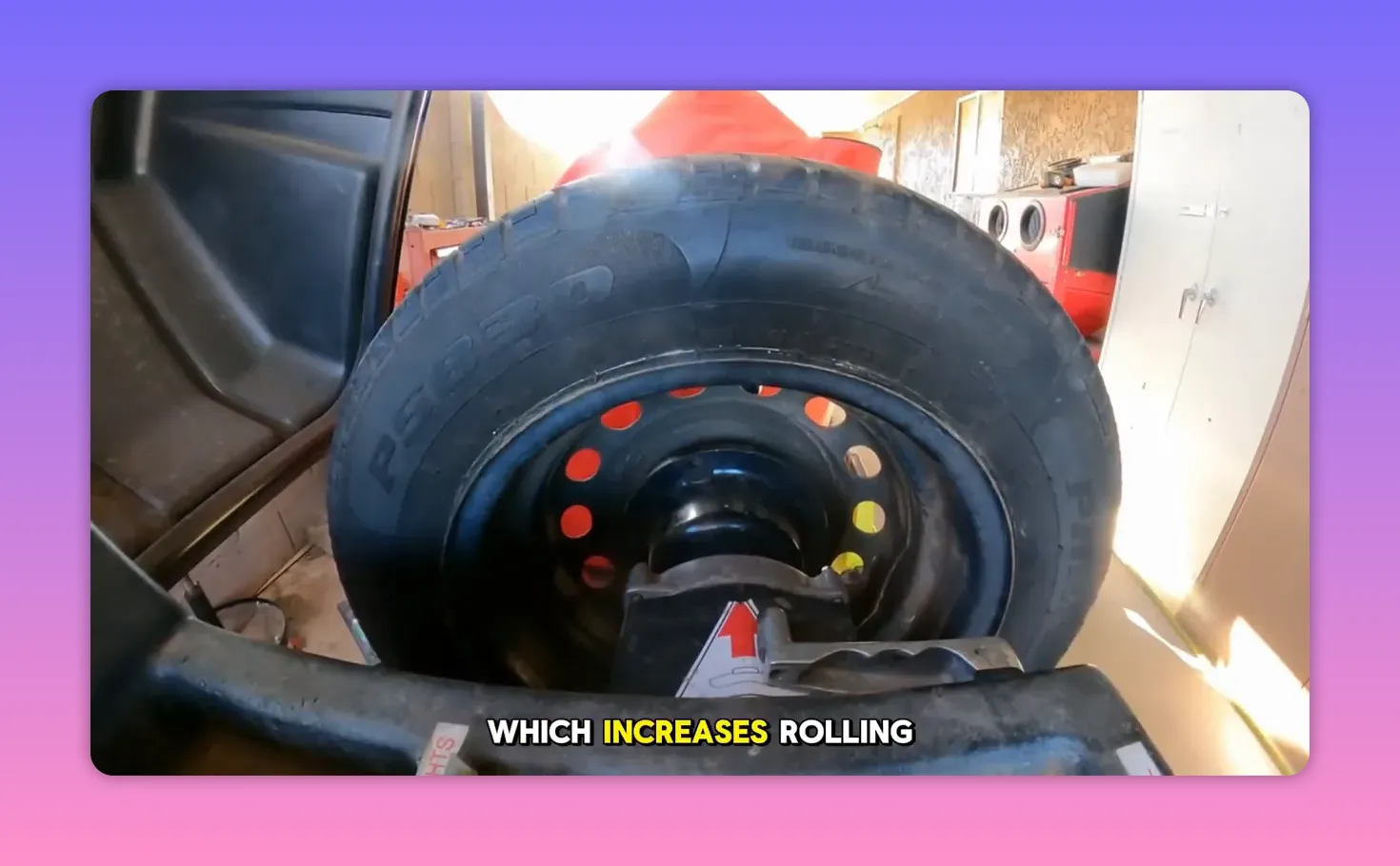 Front-facing view of a tire mounted on a wheel balancing machine with workshop background and good lighting