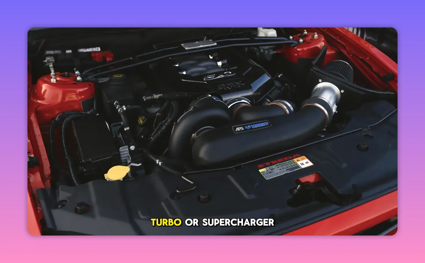 engine bay with turbocharger piping and intake installed in a red car