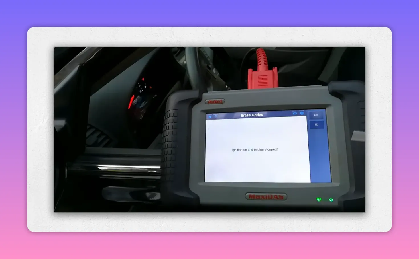 Diagnostic scanner showing an 'Erase Codes' prompt asking 'Ignition on and engine stopped?'