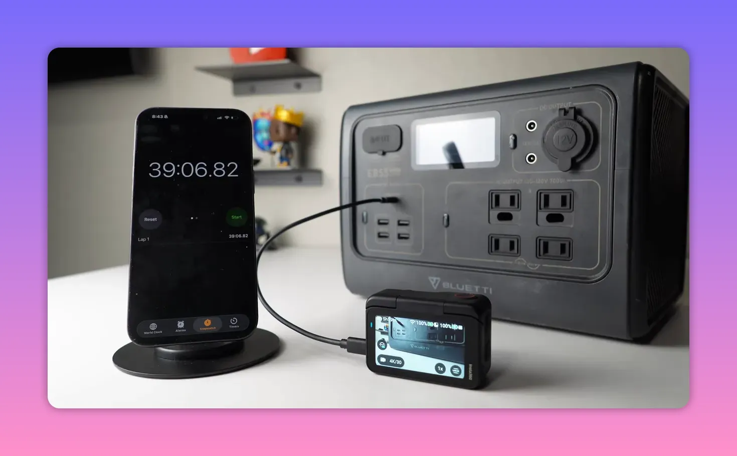 Phone stopwatch reading about 39:06 beside a Bluetti power station and the Insta360 Go Ultra connected by cable