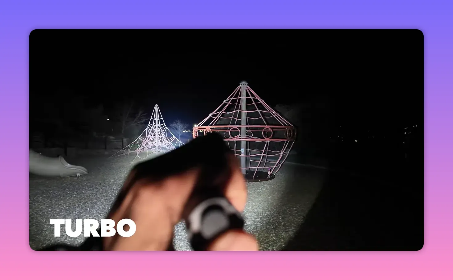 Flashlight turbo mode producing a powerful beam that brightly illuminates a playground climbing structure at night