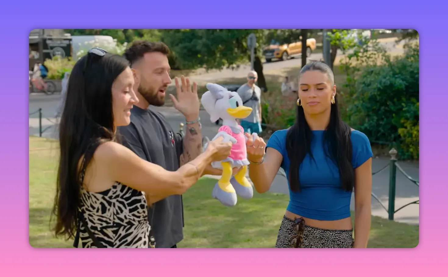 Contestants holding the hands of a Daisy Duck plush with the host counting down during the Let It Go challenge.