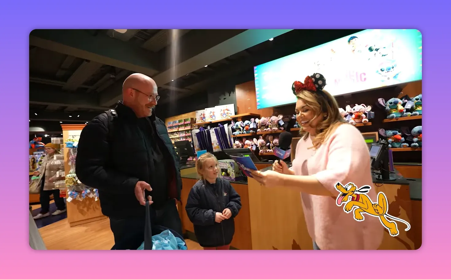 host reading quiz question to family at Disney Store activation