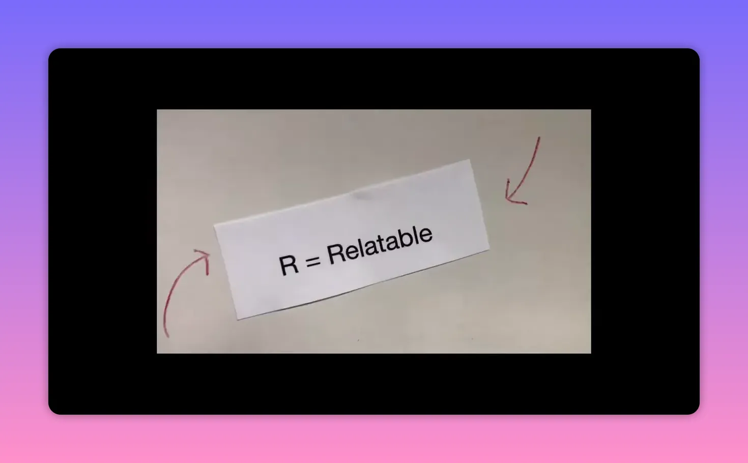 Paper label reading 'R = Relatable' with red arrows on a neutral background