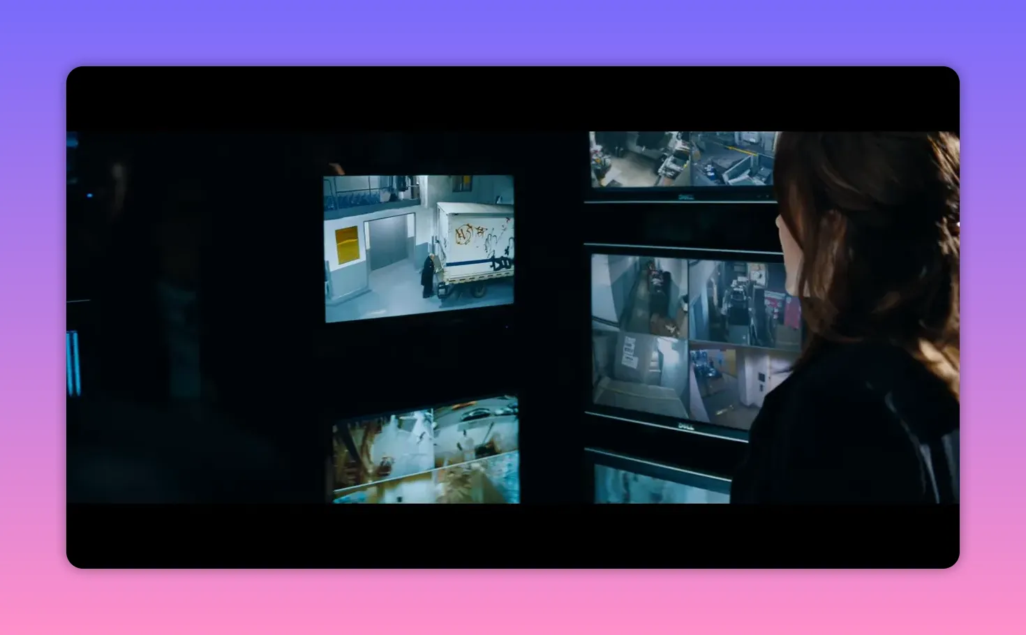 security monitor displaying a delivery truck backed up to a service elevator inside a building