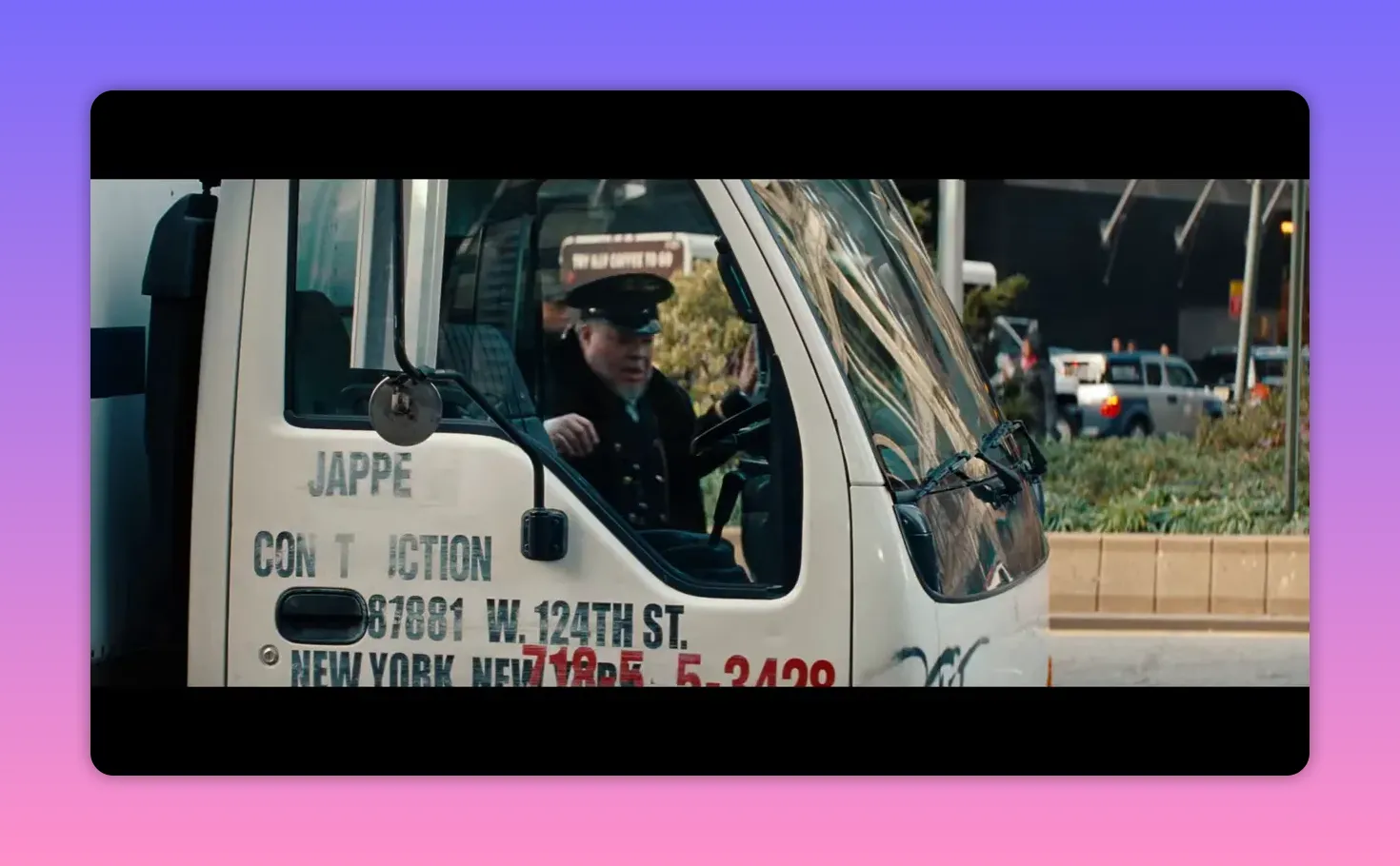 Delivery truck with driver entering the cab, company lettering on the door visible