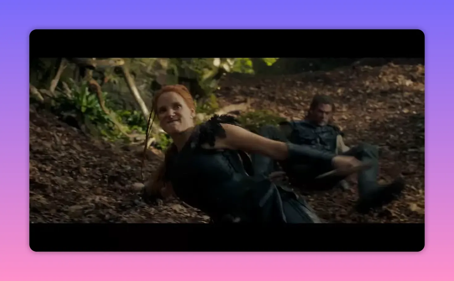 Red-haired woman and a male companion scrambling on the forest floor during an ambush, mid-action.