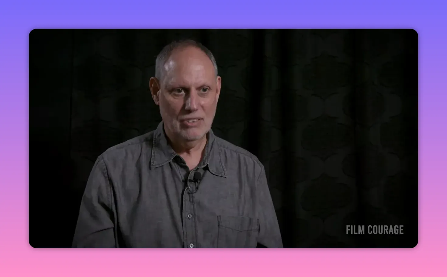 Clear interview portrait of speaker explaining the difference between story and plot