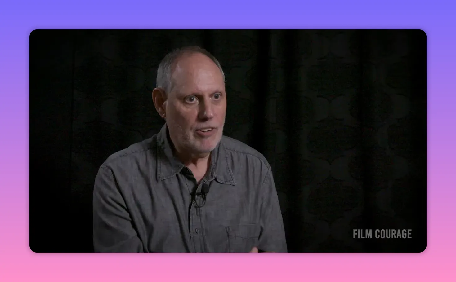 Clear mid-shot interview portrait of speaker reflecting on why not every fan becomes a creator