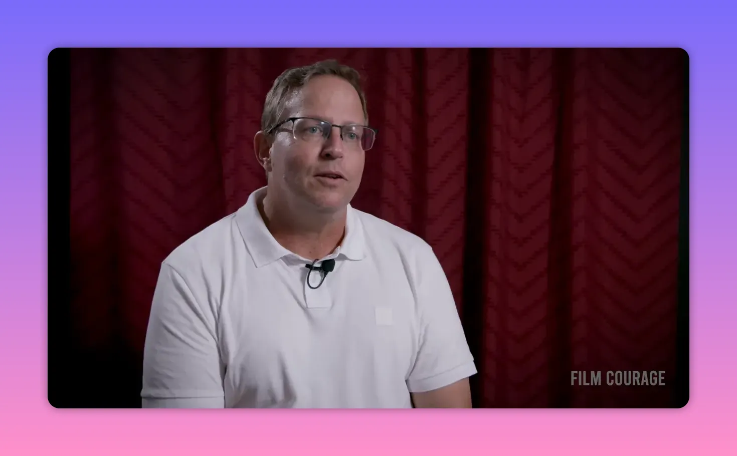 Interviewee articulating what major streamers look for when acquiring films, clear mid-shot with visible lapel mic