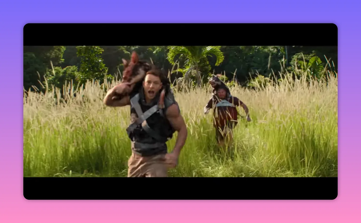 two men running through tall grass with the lead man carrying a pig over his shoulder, panicked expression