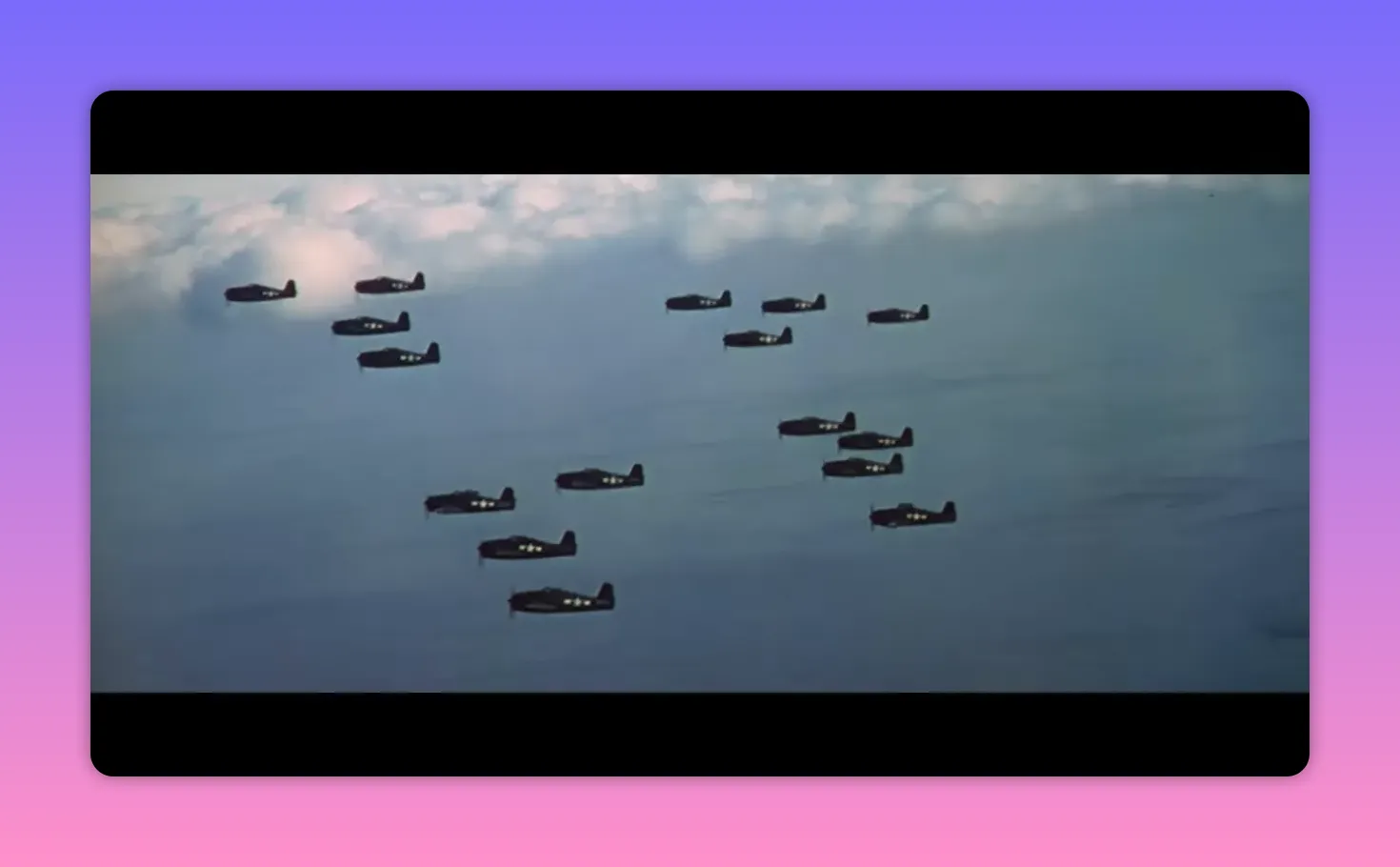 Formation of World War II dive bombers and fighters flying in formation over the ocean