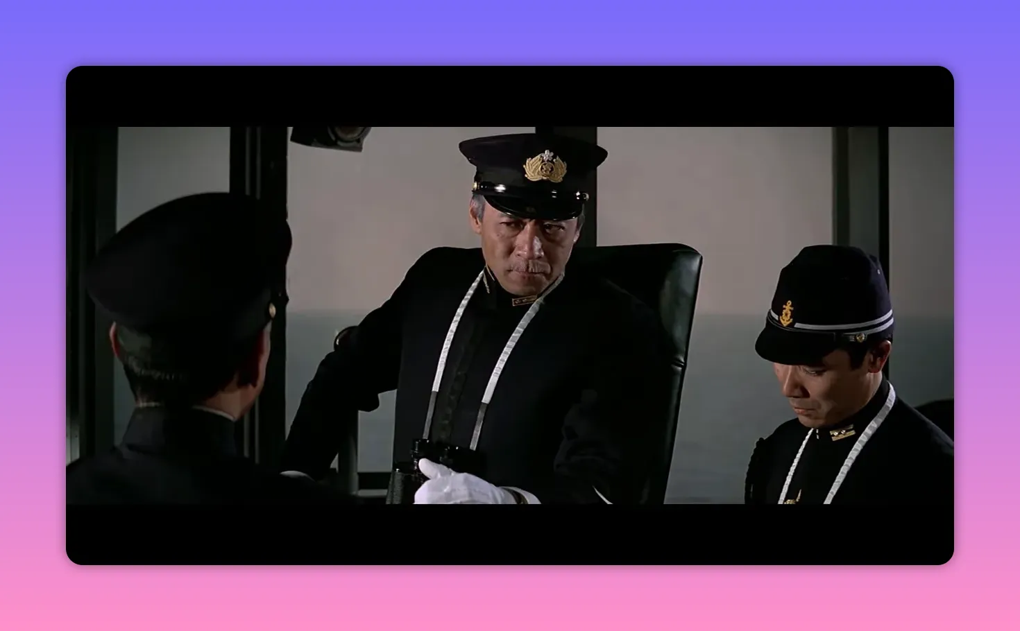 Ship commander on the bridge with binoculars and white glove, reading a report as junior officers listen