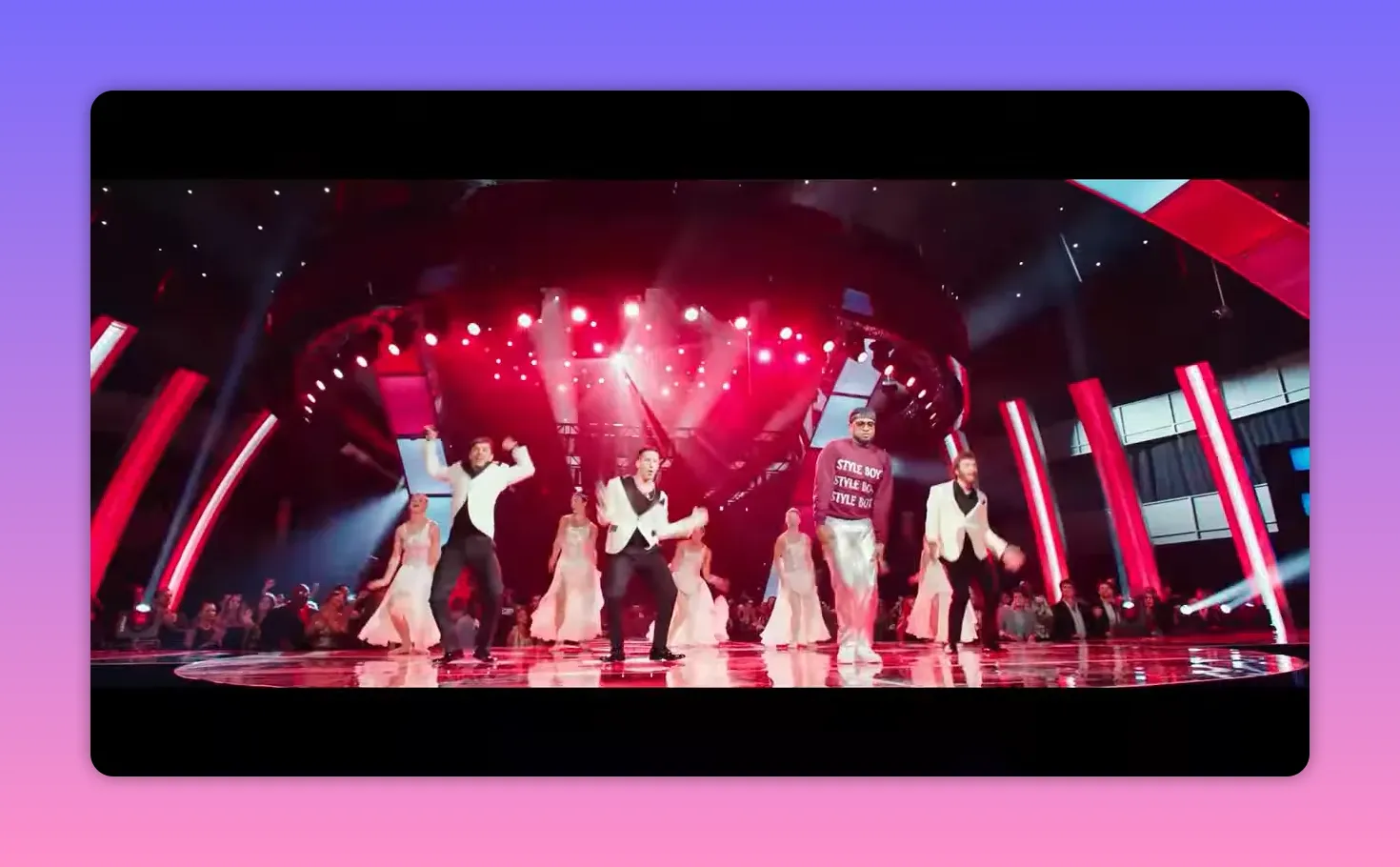 Wide, high-quality stage shot of the Style Boyz and dancers under red lights with visible set pieces