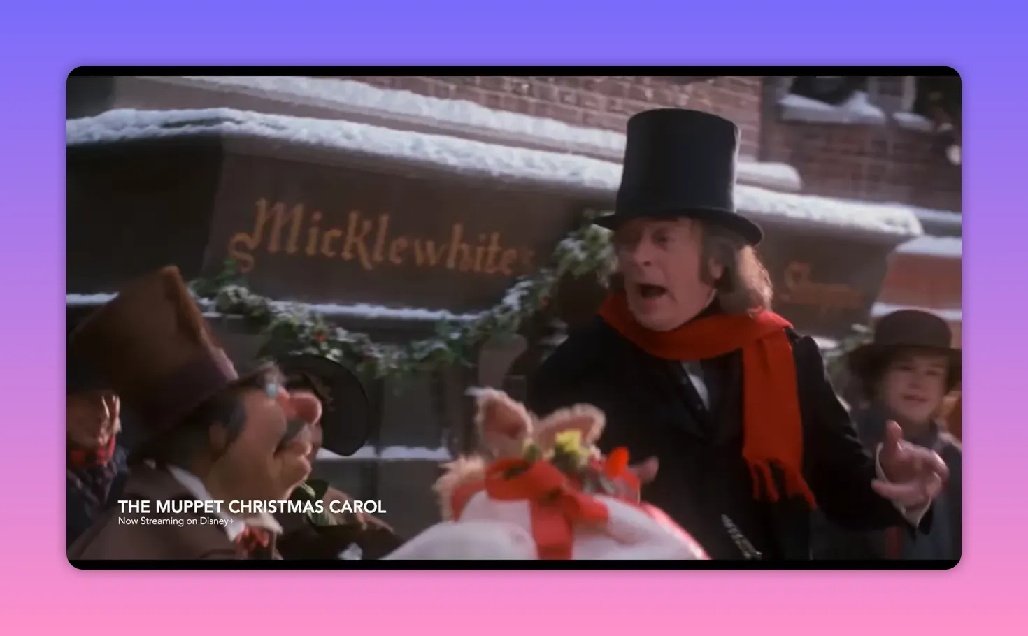 Scrooge and Muppet characters perform in a snowy miniature street set that illustrates forced perspective and puppetry staging