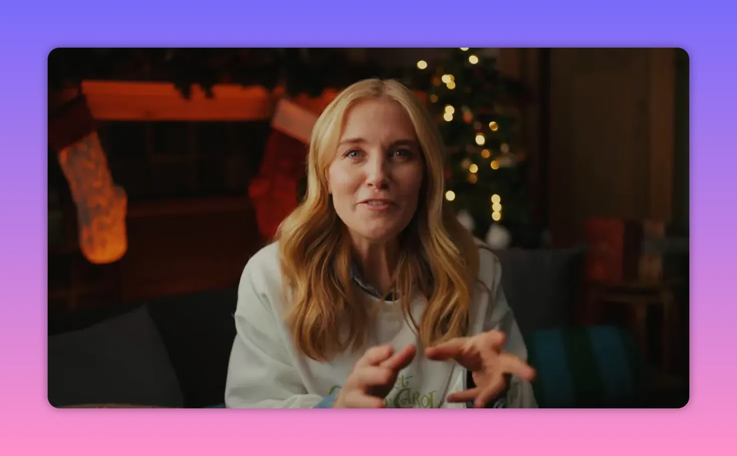 Presenter in Muppet Christmas Carol sweatshirt using hand gestures while explaining the film