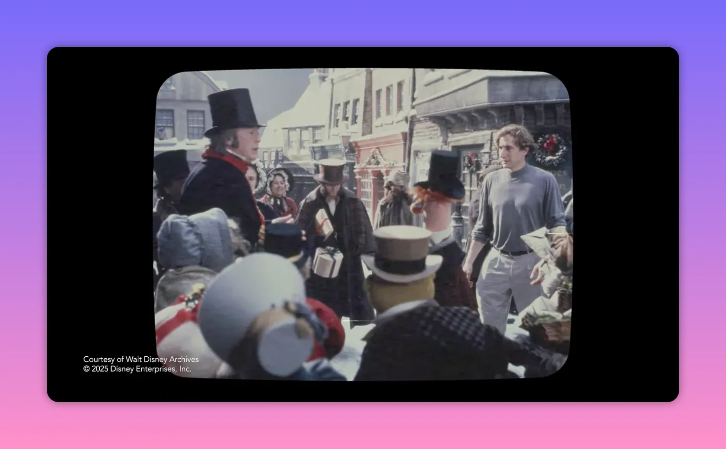 A Dickensian street scene showing human actors and Muppet characters together in a crowd, framed like archival footage.