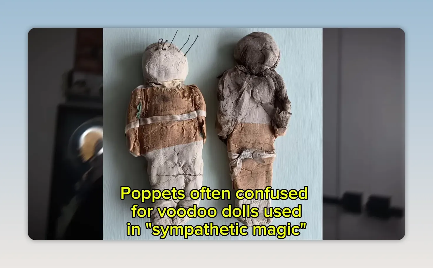 Two fabric poppets with pins against a pale background and yellow explanatory text