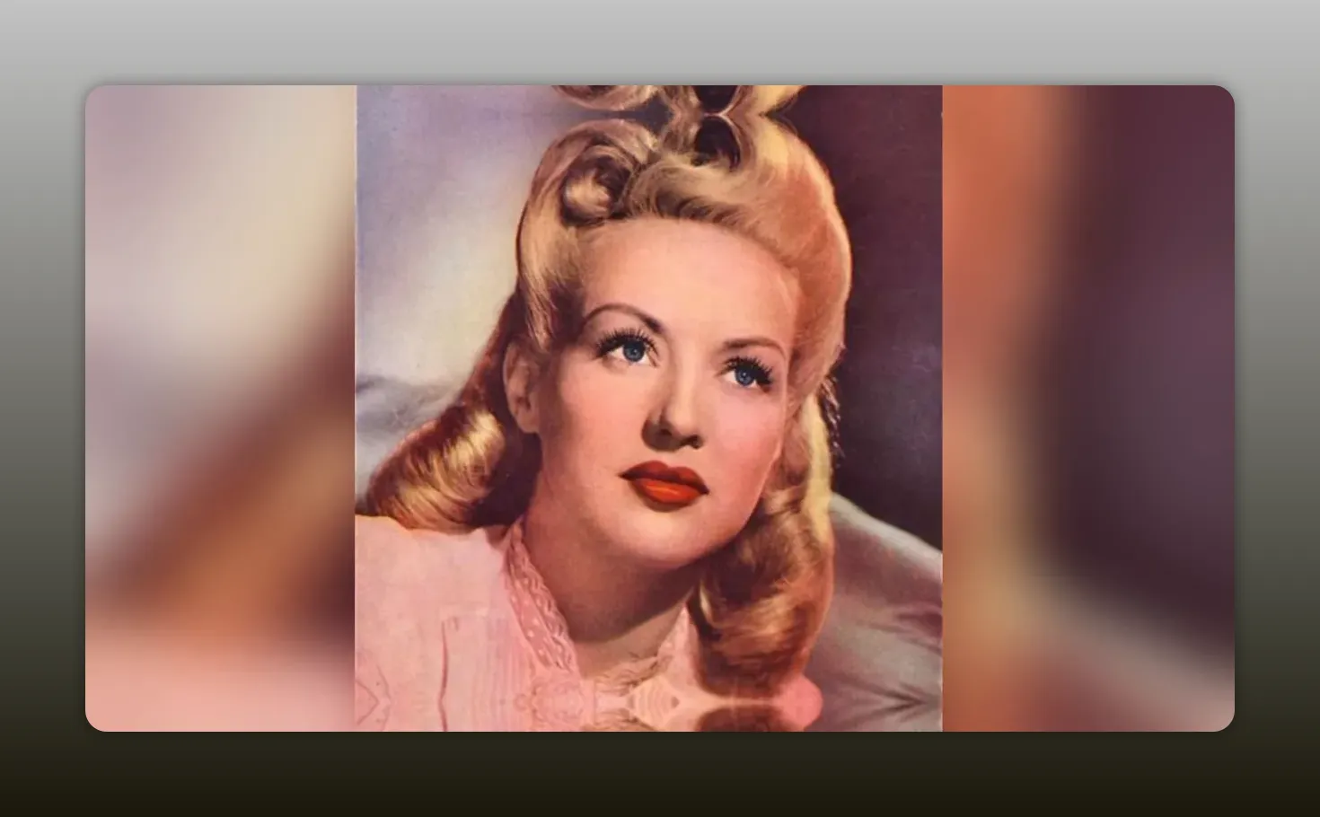 Portrait of a blonde actress in 1940s waves and makeup, clear head-and-shoulders close-up