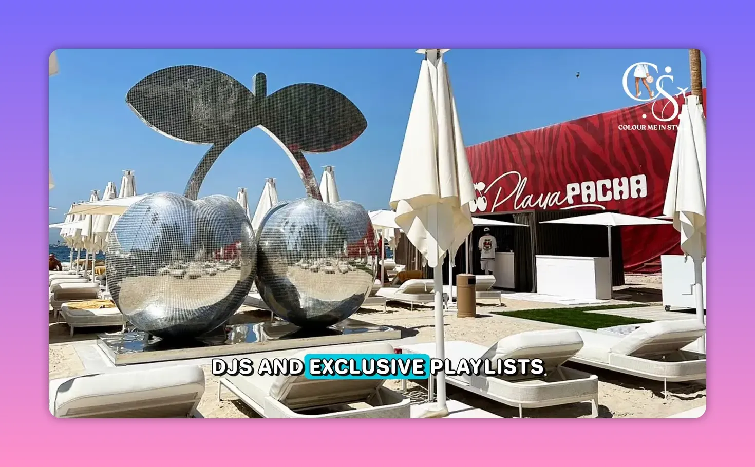 Playa Pacha beach club loungers and white umbrellas with skyline view