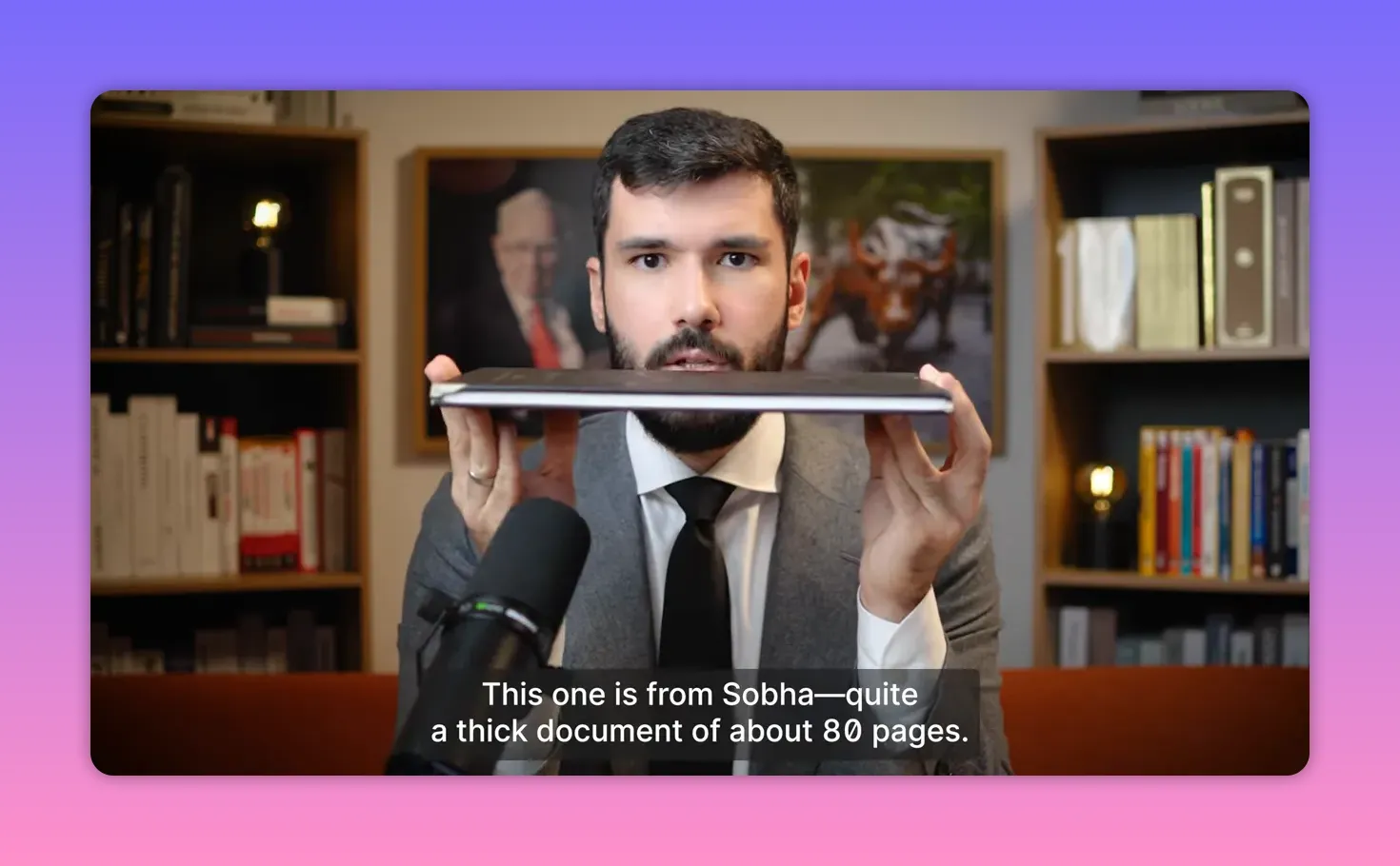 Presenter holding a contract horizontally to show the document's thickness