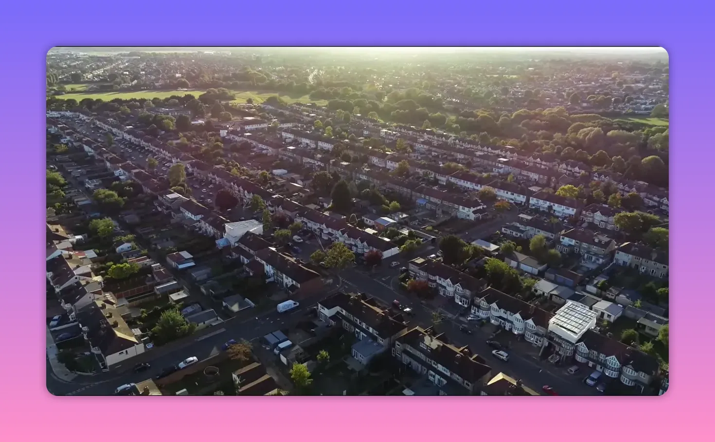 Aerial view of London residential neighbourhood under warm sunlight