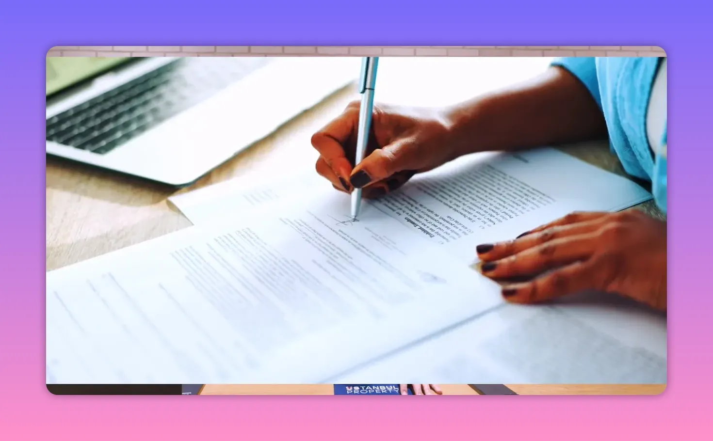 Hands signing property documents with a pen