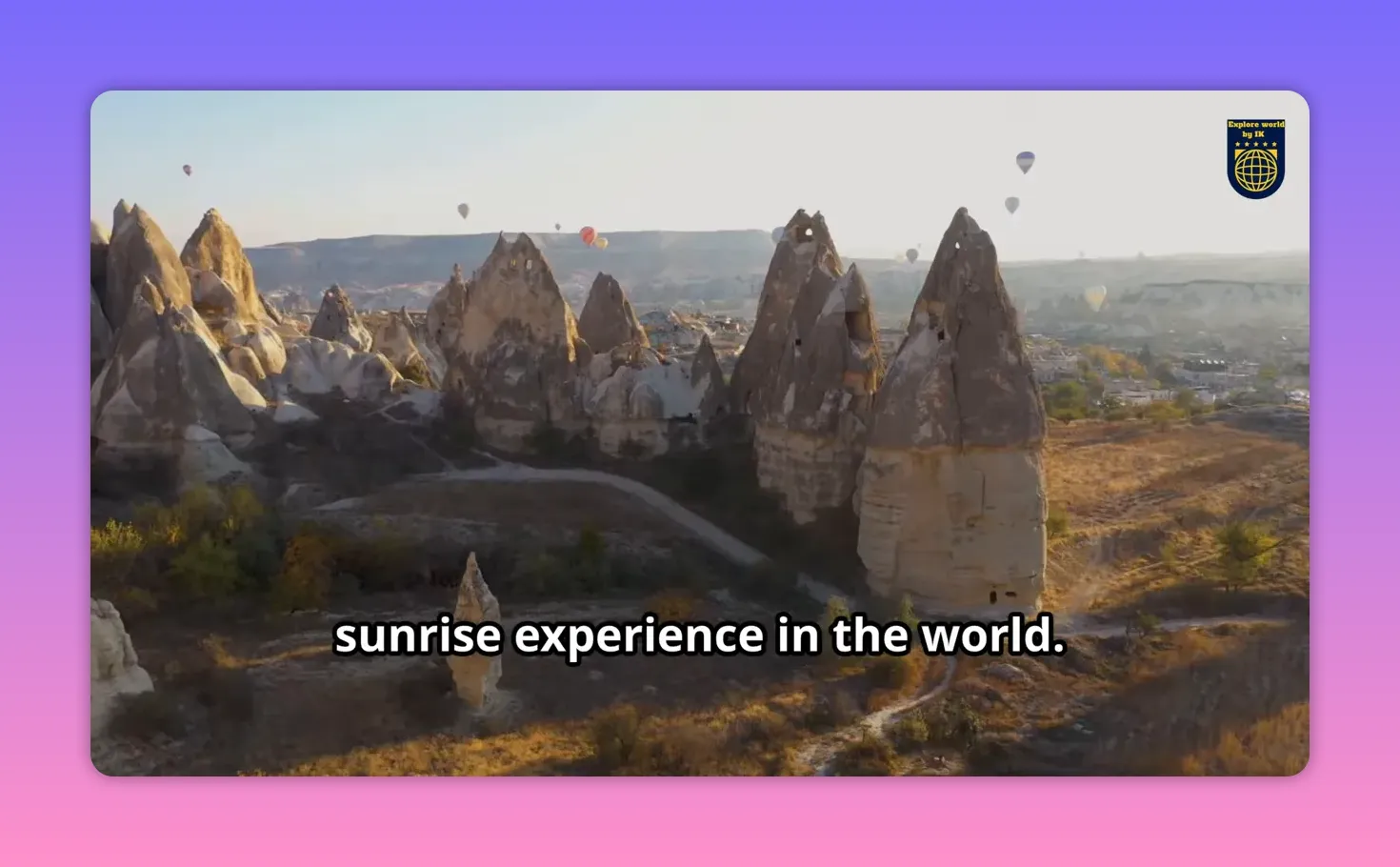 Hot air balloons over Cappadocia rock spires at sunrise, clear aerial shot