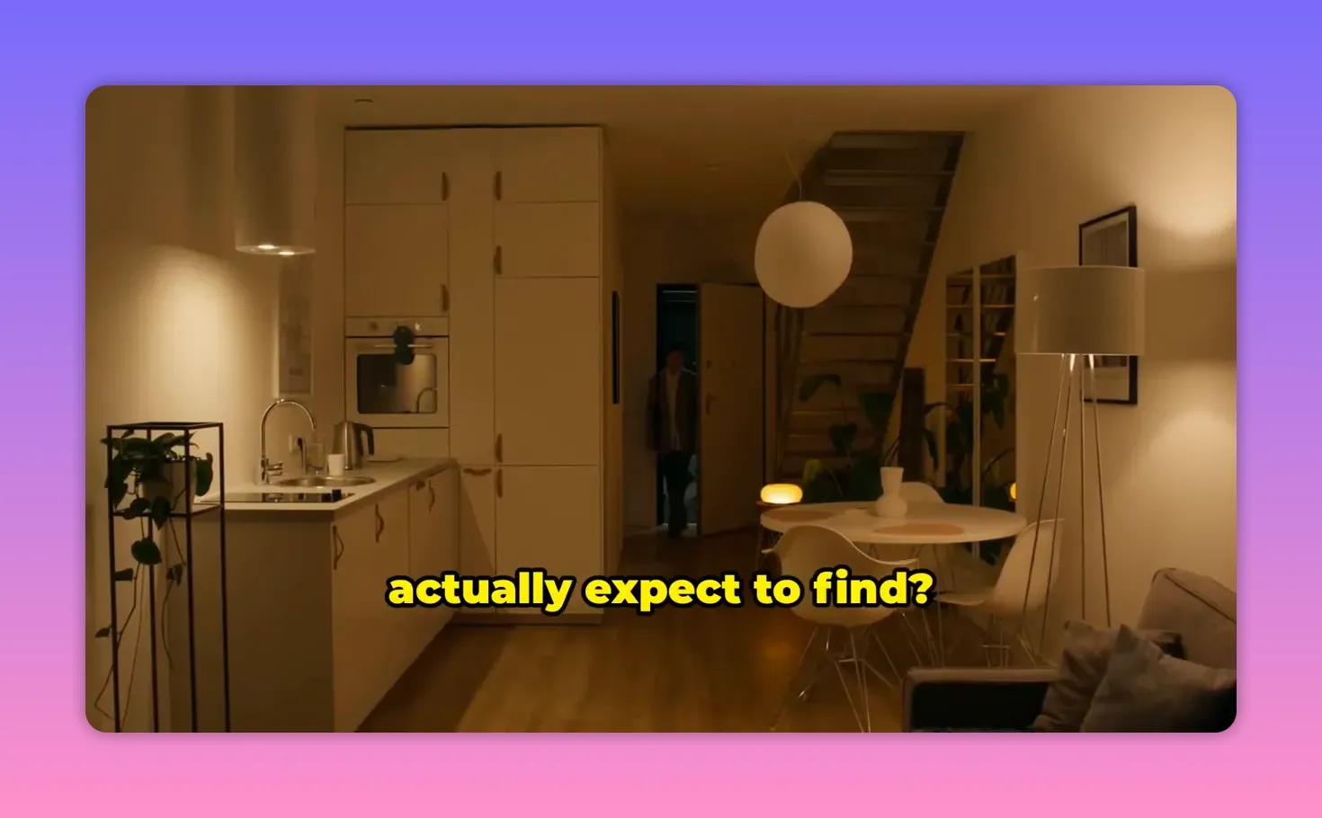 Interior view of a modern furnished apartment with kitchen cabinets, dining area, and warm lighting in Antalya