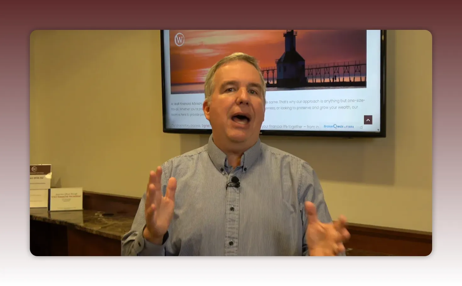 financial advisor explaining cash management with clear hand gestures and a presentation screen behind him