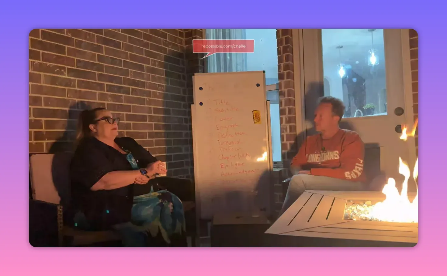 Patio conversation at night: two people talking with a whiteboard of prioritized notes between them and a fire table to the right.