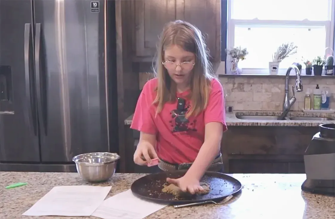 Cutting out homemade rabbit treats with cookie cutter