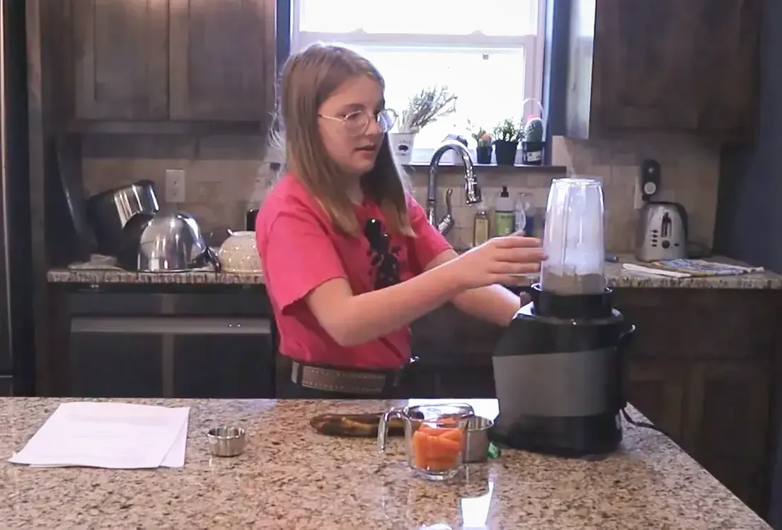 Pulverizing rabbit pellets in a blender for homemade rabbit treats